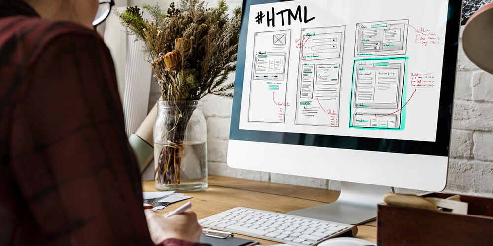 Web designer setting up a business website - ways to better optimize your website.