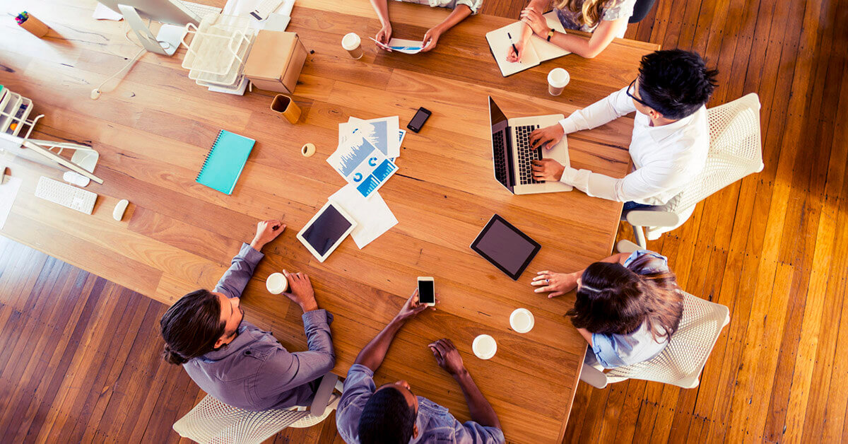 Group of diverse sales professionals conducting a meeting about their inbound website content.